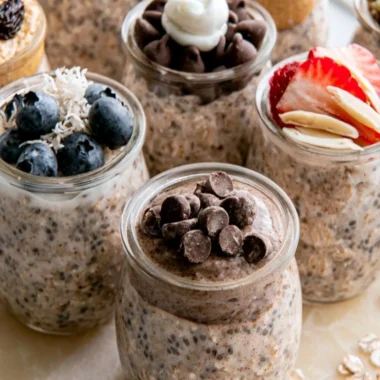 Bowl of high-protein overnight oats topped with fruits and nuts