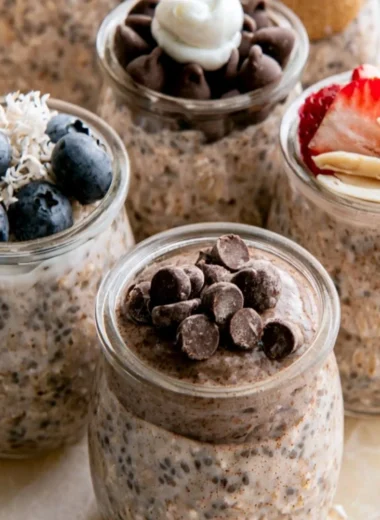 Bowl of high-protein overnight oats topped with fruits and nuts