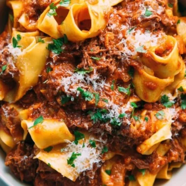 Delicious homemade short rib ragu served on pasta