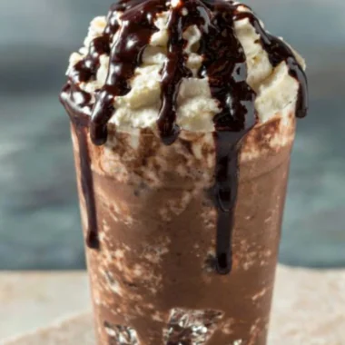 Delicious iced mocha coffee with chocolate drizzle and whipped cream