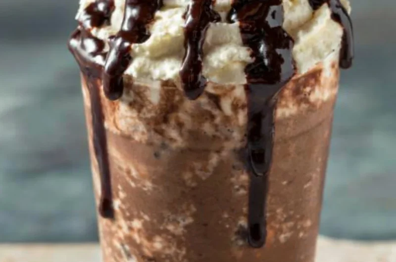 Delicious iced mocha coffee with chocolate drizzle and whipped cream