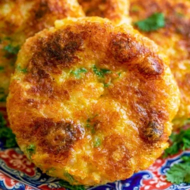 Crispy potato cutlet served with chutney on a plate.
