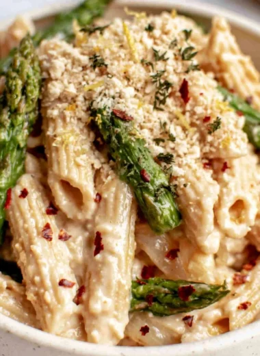 Vegan Lemon White Bean Pasta garnished with herbs in a bowl