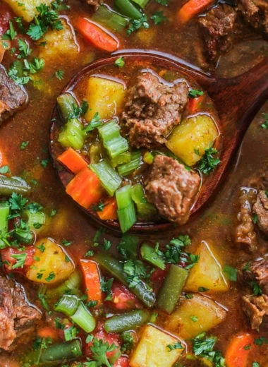 Bowl of hearty Vegetable Beef Soup filled with fresh vegetables and tender beef.