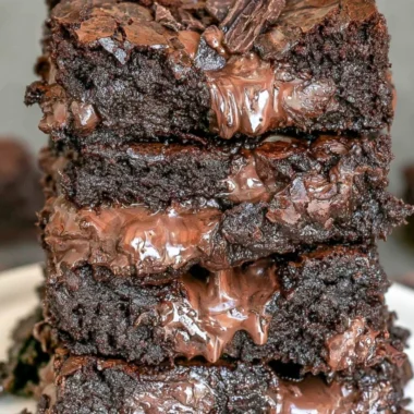 Delicious 100 calorie fudge brownies served on a plate, ideal for dessert lovers.