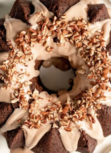 Gingerbread Bundt Cake topped with Maple Cinnamon Glaze on a plate