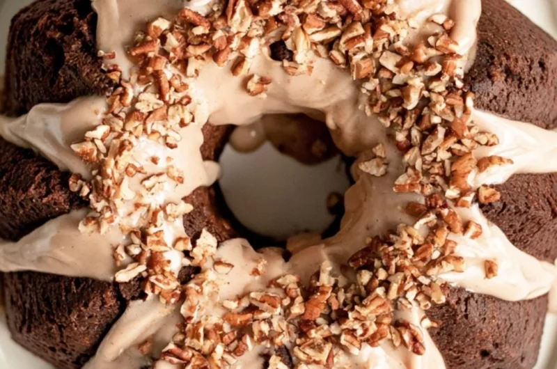 Gingerbread Bundt Cake topped with Maple Cinnamon Glaze on a plate